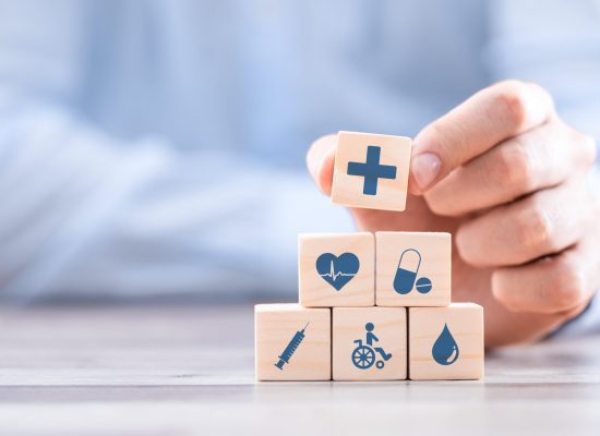 Healthcare symbols on wooden blocks